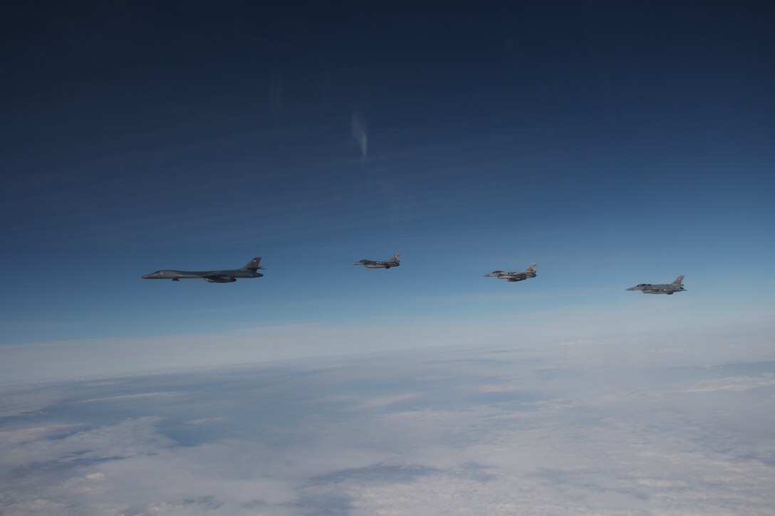 Military aircraft flying in the sky