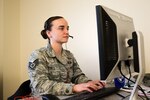 Staff Sgt. Natalie Howes of the 260th Air Traffic Control Squadron, New Hampshire Air National Guard, helping answer calls about unemployment benefits with Task Force Call Center at the Edward Cross Training Center in Pembroke, New Hampshire, May 2020.