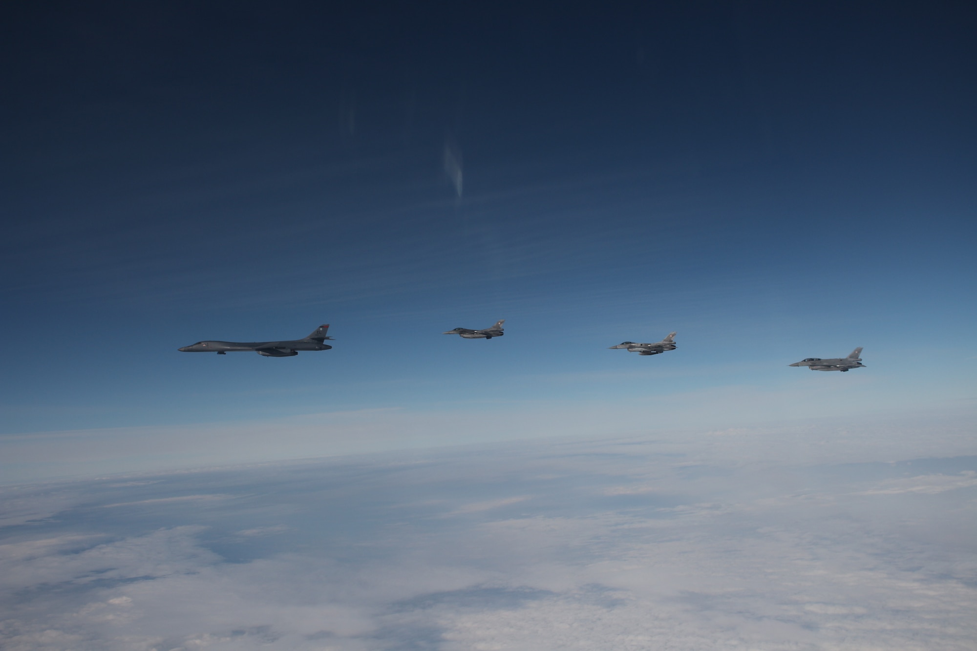 Military aircraft flying in the sky