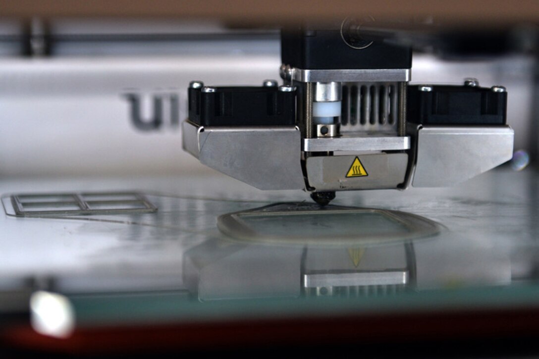A 3D printer produces  a computer-aided design.