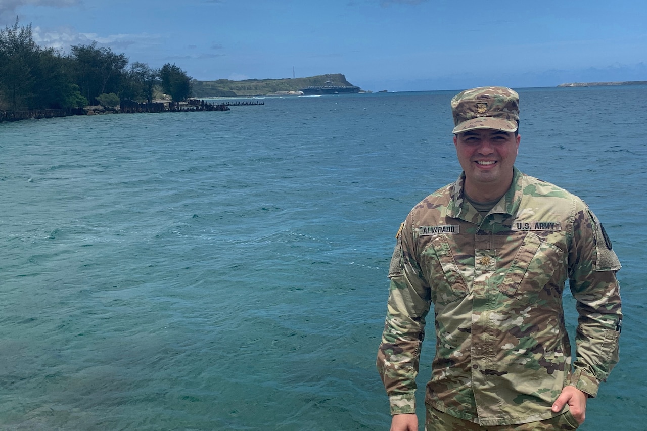 Army officer poses for a photo.
