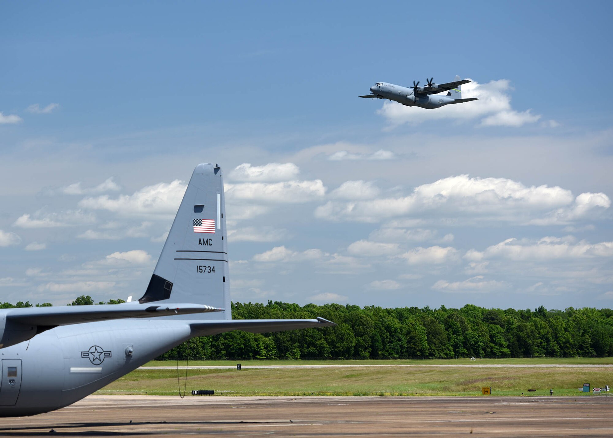 Airmen sit on the ramp of an aircraft before take off