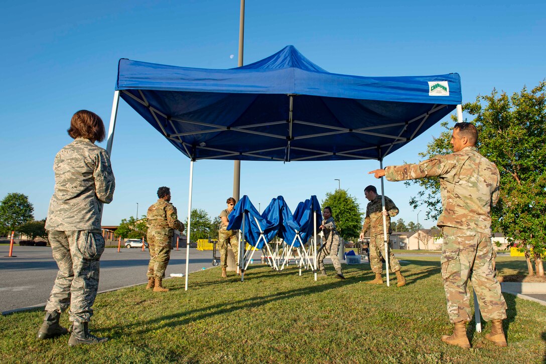 Photo of Airmen preparing for a COVID-19 Tier 2 screening.