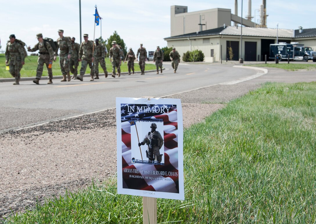 Members of the 341st Security Forces Group participate in a 5K memorial road march during National Police Week May 14, 2019, at Malmstrom Air Force Base, Mont.