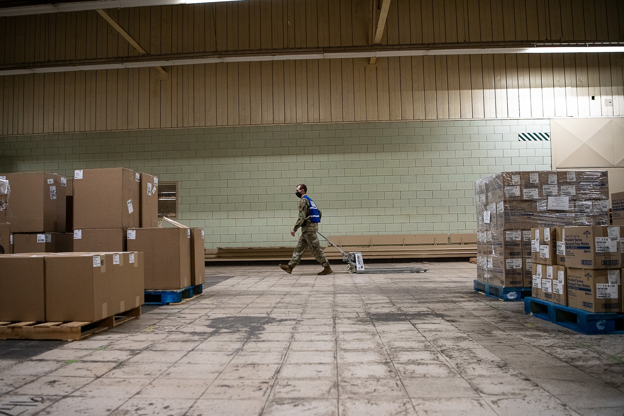 Oklahoma National Guard Spc. James Bates with Headquarters Company, 545th Brigade Engineer Battalion, 45th Infantry Brigade Combat Team, pulls an empty pallet to the front of the Strategic National Stockpile Warehouse as he gathers equipment and medical supplies while assigned to the Stockpile Warehouse in Oklahoma City, April 17, 2020. The nearly 30 Guardsmen assigned to the site — partnered with state agencies to include the Oklahoma Department of Emergency Management, Oklahoma Department of Public Safety, Oklahoma Department of Transportation, Oklahoma Office of Homeland Security and the Oklahoma Department of Corrections — help fulfill, secure and transport the orders to facilities within the 11 identified COVID-19 regional health administration regions throughout Oklahoma as part of the State’s whole-of-government response to the pandemic. (U.S. Air National Guard photo by Tech. Sgt. Kasey Phipps)