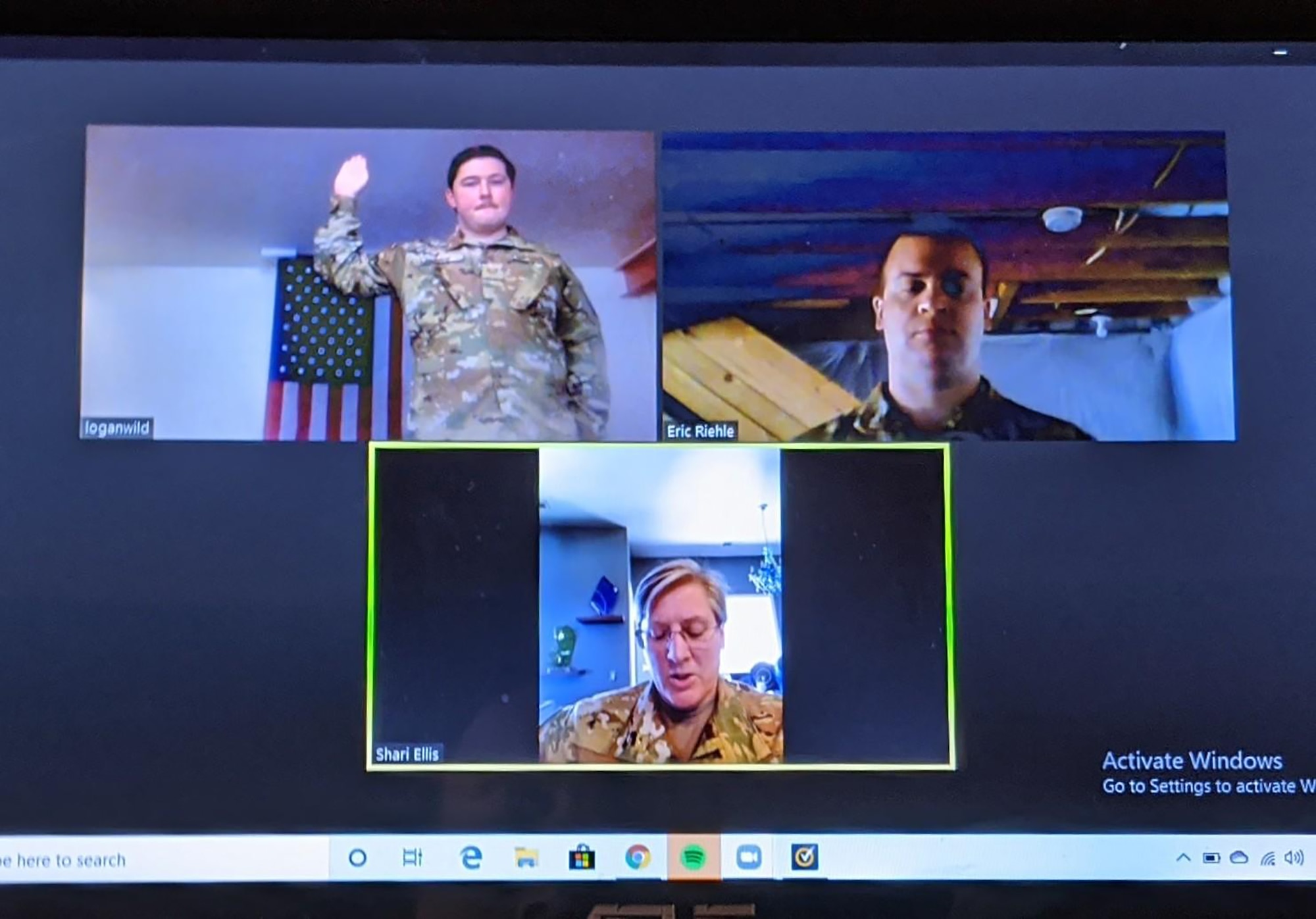 Lt. Col. Sharon Ellis, 445th Aeromedical Evacuation Squadron flight nurse, administers the Oath of Enlistment virtually to Staff Sgt. Logan Wild, 445th AES aeromedical evacuation technician as he re-enlists May 4, 2020. Master Sgt. Eric Riehle, 445th AES career advisor, witnesses via video conferencing  Ellis is Wild’s supervisor and resides in Utah, while Wild lives in Columbus, Ohio.