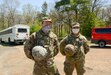 Two Pennsylvania National Guard soldiers stopped to render first aide to a motorcycle crash victim along Interstate 78 near Fort Indiantown Gap May 1.