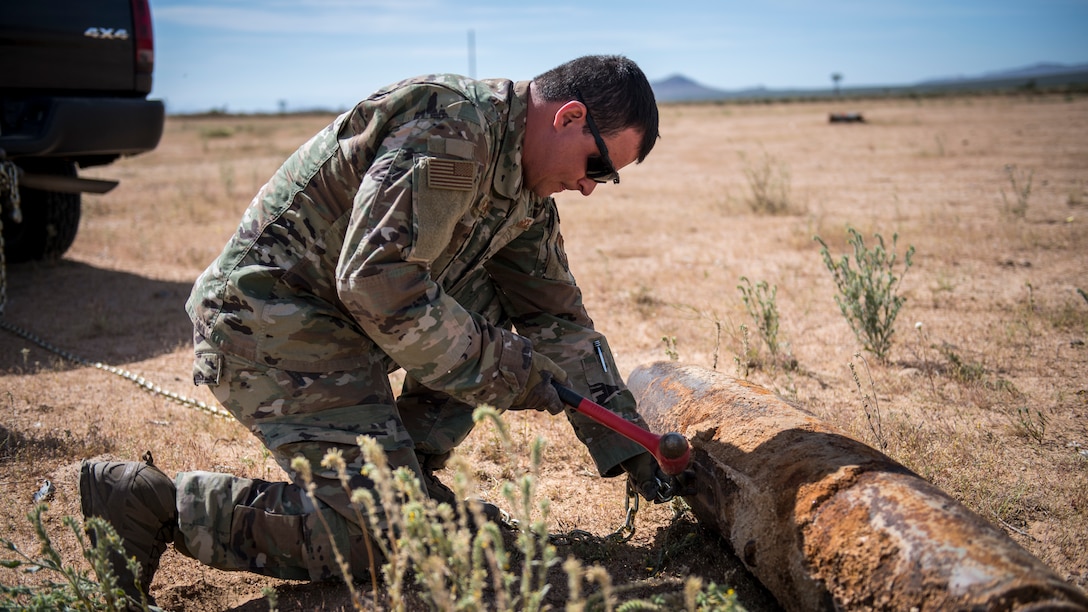 Members of the Explosive Ordnance Disposal unit, 812th Civil Engineer Squadron, 412th Test Wing, prepare unexploded ordnance and training munitions for demolition at the Precision Impact Range Area at Edwards Air Force Base, California, May 7. The 412th Test Wing uses the PIRA to conduct weapons and payload drops for flight tests. (Air Force photo by Giancarlo Casem)