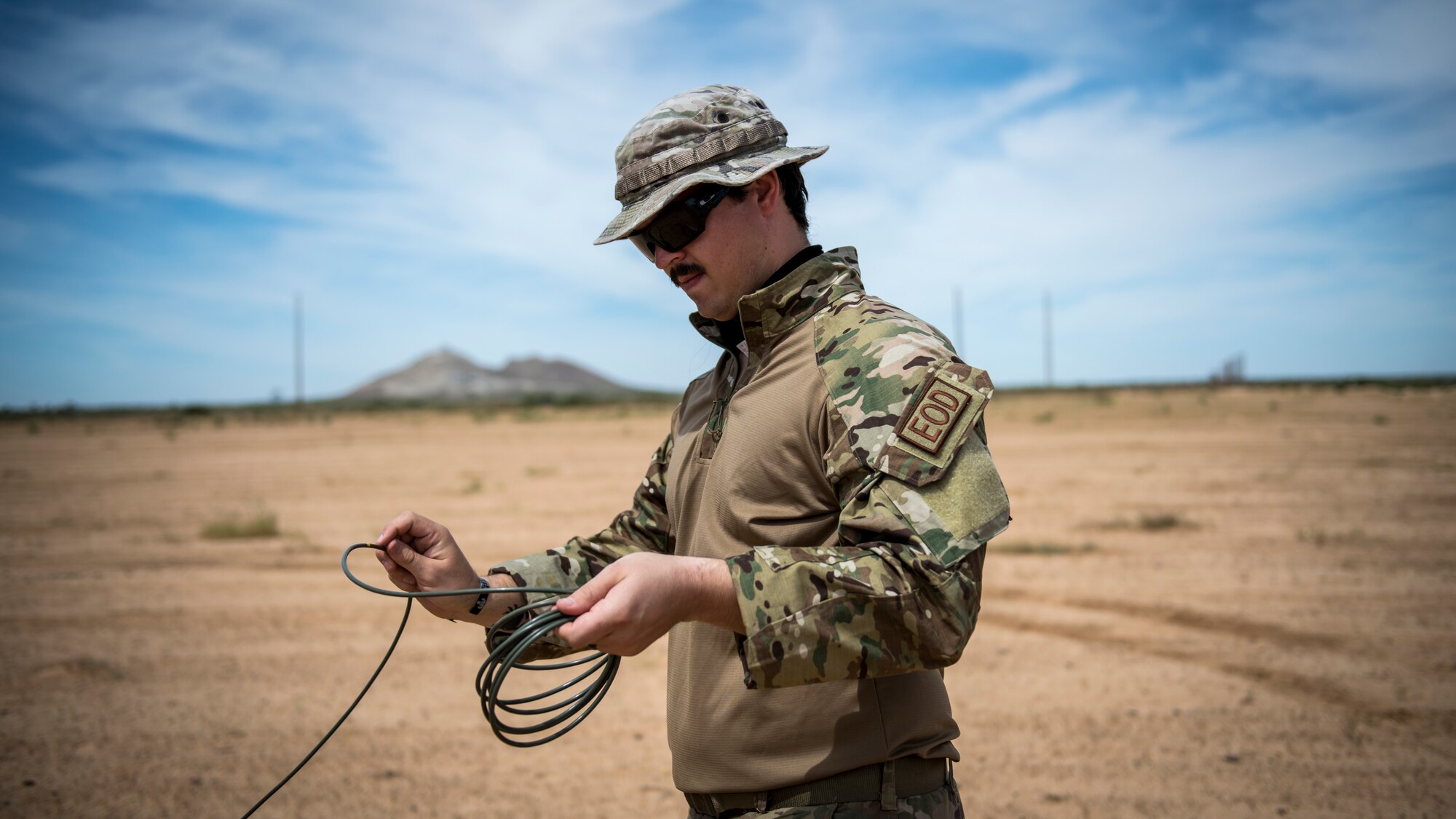 Members of the Explosive Ordnance Disposal unit, 812th Civil Engineer Squadron, 412th Test Wing, prepare unexploded ordnance and training munitions for demolition at the Precision Impact Range Area at Edwards Air Force Base, California, May 7. The 412th Test Wing uses the PIRA to conduct weapons and payload drops for flight tests. (Air Force photo by Giancarlo Casem)