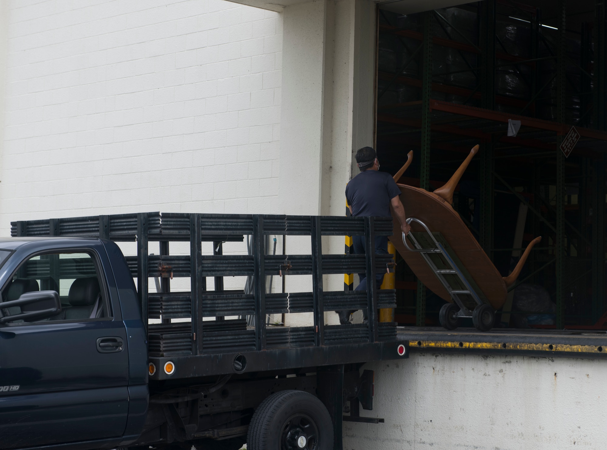 Employee moving a table.