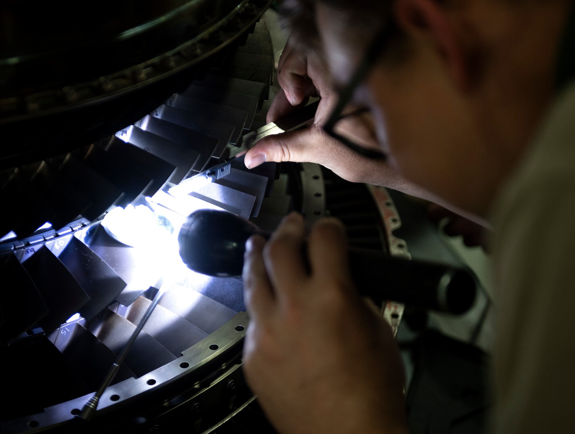 A propulsion flight Airman assigned to the 48th Component Maintenance Squadron inspects engine blades at Royal Air Force Lakenheath, England, April 29, 2020. The propulsion flight contributed to the 48th Maintenance Group earning the 2019 USAFE-AFAFRICA Clements McMullen Memorial Daedalian Weapon System Maintenance Trophy for a third consecutive year. (U.S. Air Force photo by Airman 1st Class Madeline Herzog)