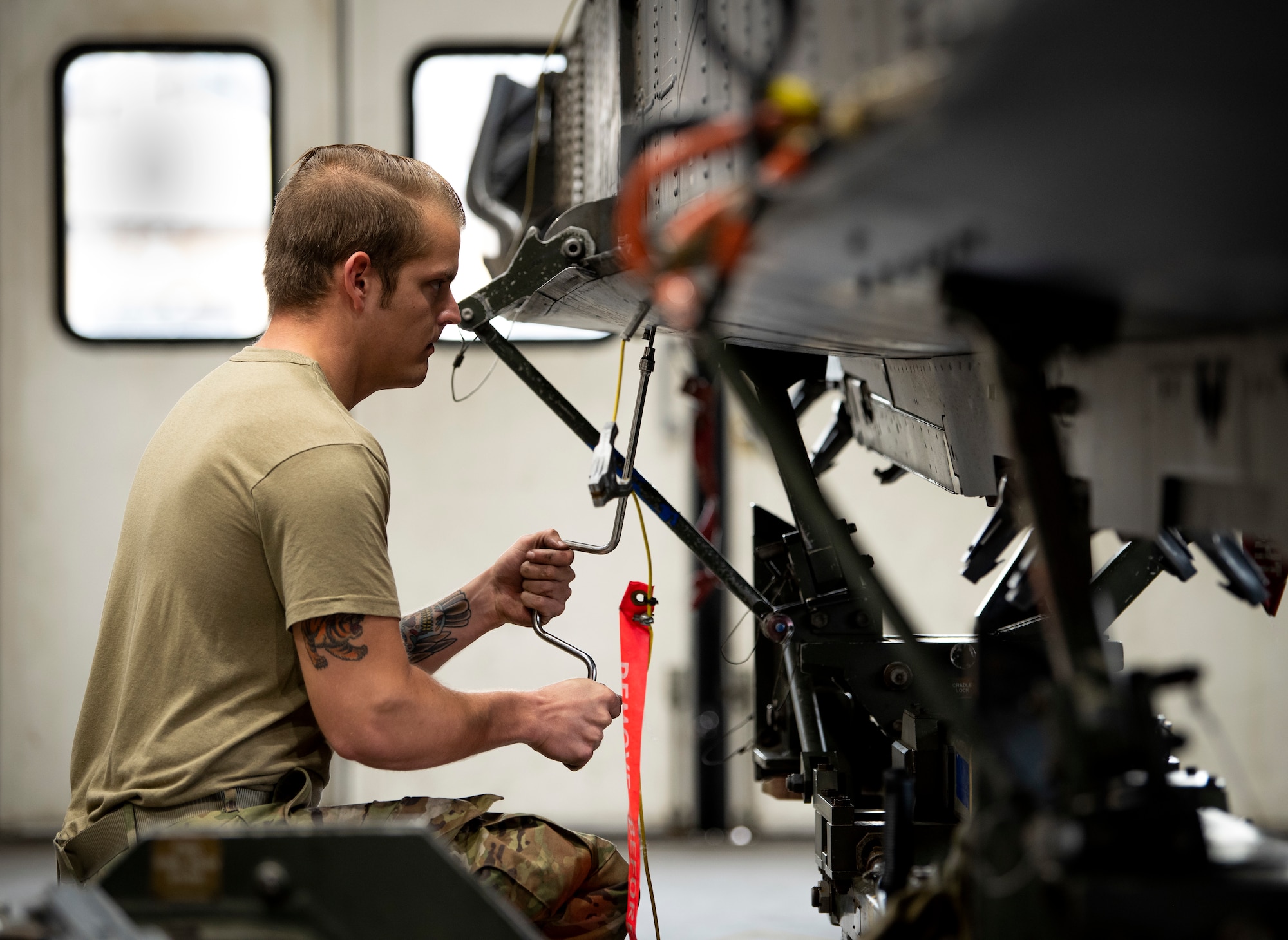 A fuels system repair technician assigned to the 48th Maintenance Group prepares an external fuel tank for transport at Royal Air Force Lakenheath, England, April 30, 2020. The Liberty Wing’s fuel systems Airmen helped the 48th Maintenance Group earn the 2019 USAFE-AFAFRICA Clements McMullen Memorial Daedalian Weapon System Maintenance Trophy for a third consecutive year. (U.S. Air Force photo by Airman 1st Class Madeline Herzog)