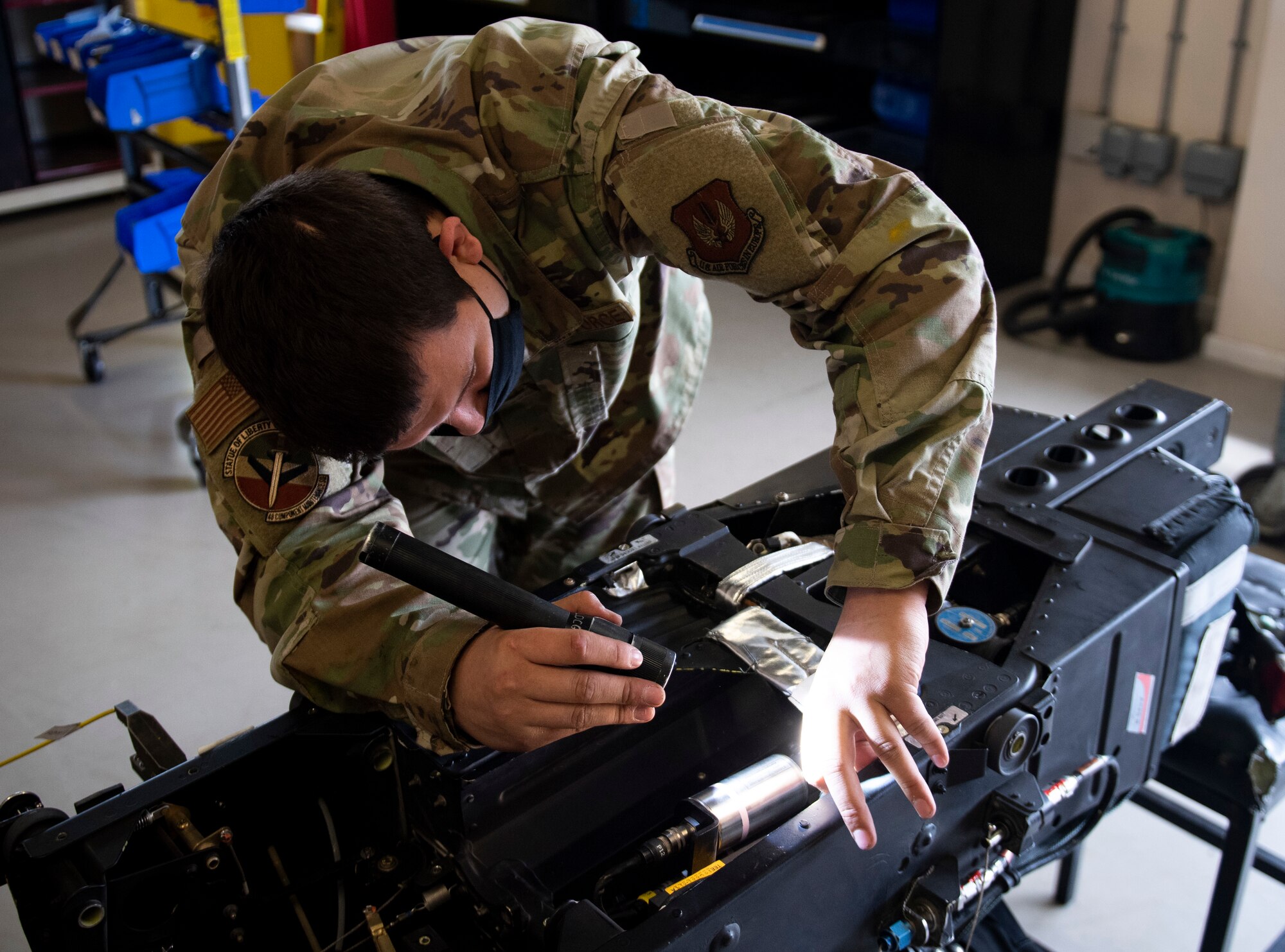 An accessories flight Airman assigned to the 48th Maintenance Group performs a maintenance check on a pilot seat at Royal Air Force Lakenheath, England, April 30, 2020. The egress shop helped the 48th MXG earn the 2019 USAFE-AFAFRICA Clements McMullen Memorial Daedalian Weapon System Maintenance Trophy. (U.S. Air Force photo by Airman 1st Class Madeline Herzog)
