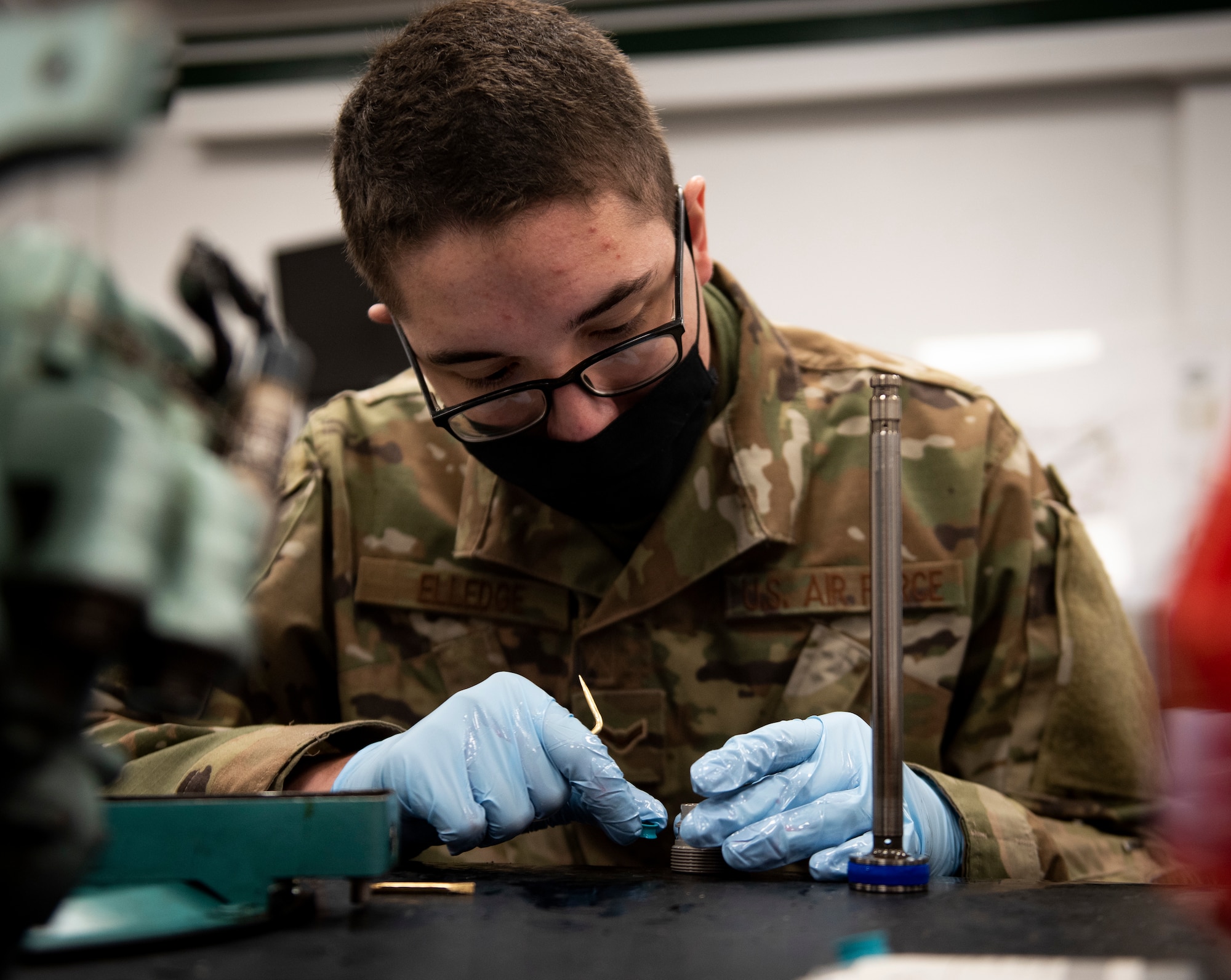A hydraulic systems Airman assigned to the 48th Maintenance Group cleans an aircraft part at Royal Air Force Lakenheath, England, April 30, 2020. The hydraulics shop helped the 48th MXG earn the 2019 USAFE-AFAFRICA Clements McMullen Memorial Daedalian Weapon System Maintenance Trophy for a third consecutive year. (U.S. Air Force photo by Airman 1st Class Madeline Herzog)