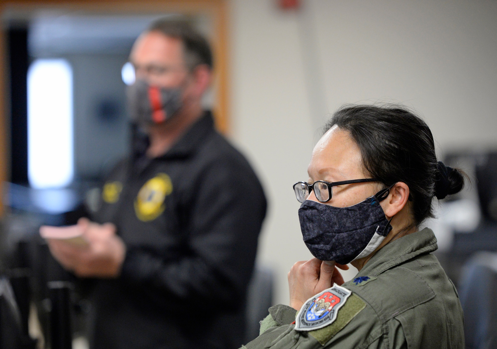 Lt. Col. Hui Ling Li, Wright-Patterson Air Force Base COVID-19 incident commander and 88th Medical Group chief of Aerospace Medicine, and Jacob King, left, 88th Air Base Wing Incident Command Center fire chief, brief 88 ABW Incident Command Center personnel at Wright-Patterson Air Force Base, Ohio, May 5, 2020. (U.S. Air Force photo/Ty Greenlees)