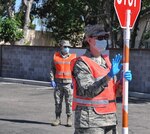 Nevada National Guard Senior Airman Fallon Quino with Task Force Med controls a traffic entry point at the voluntary COVID-19 mapping site April 28, 2020, in Las Vegas.