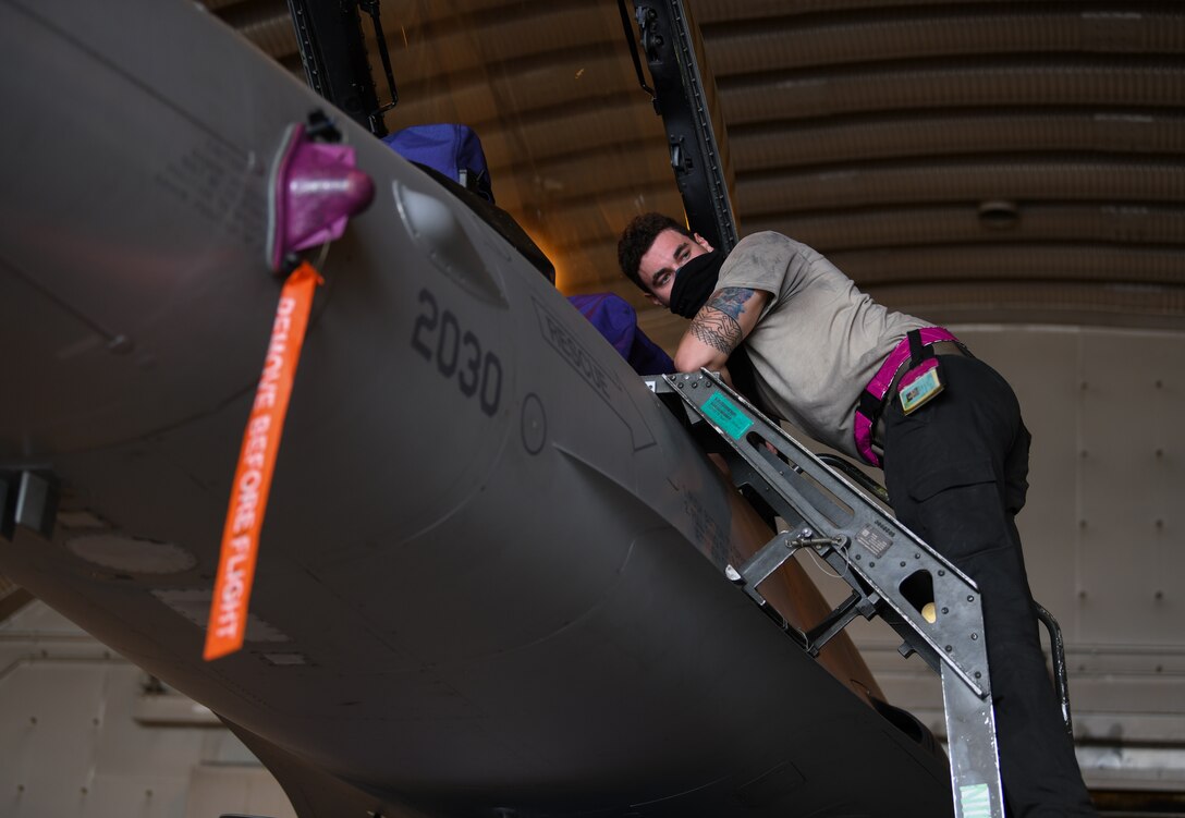 U.S. Air Force Airman 1st Class Corey Chalupa, 31st Aircraft Maintenance Squadron, 510th Aircraft Maintenance Unit crew chief, climbs a ladder to check an F-16 Fighting Falcon aircraft before it is refueled at Aviano Air Base, Italy, May 12, 2020. During WWII, the 510th FS moved to mainland Europe with the advance of Allied troops, flying from Picauville and St Dizier, France; Ophoven, Belgium; and Kitzingen, Germany. The unit was credited with 39 kills. (U.S. Air Force photo by Airman 1st Class Ericka A. Woolever)