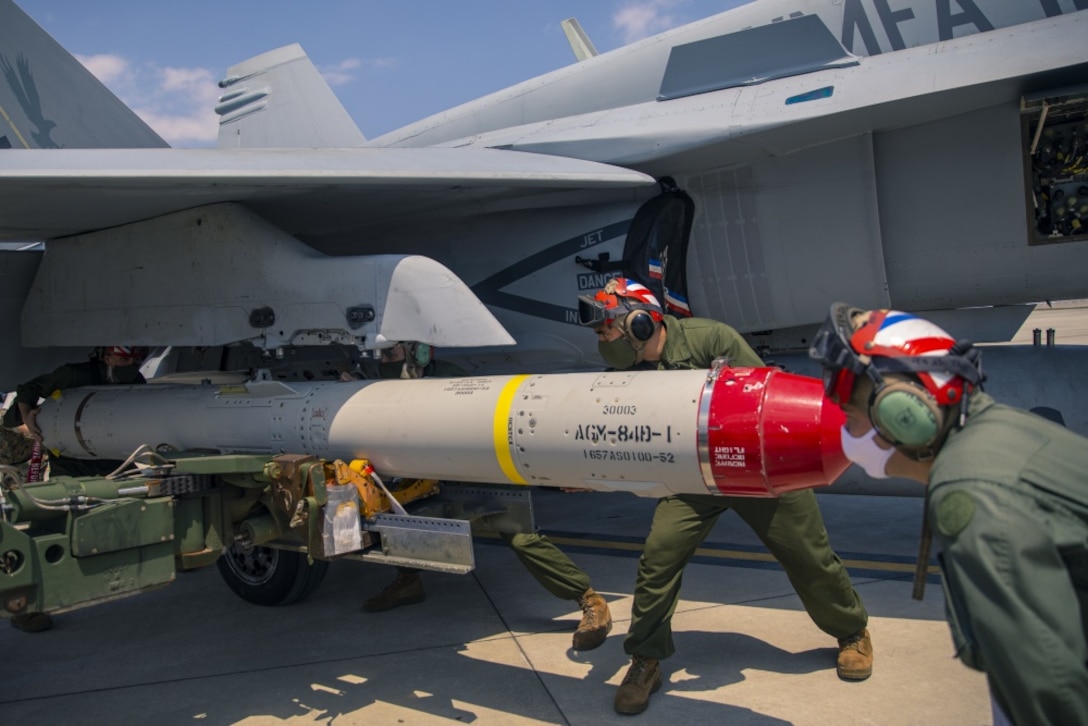 U.S. Marines load AGM-84D Harpoon missiles onto a F/A-18 Hornet aboard Marine Corps Air Station Iwakuni, Japan, April 28.