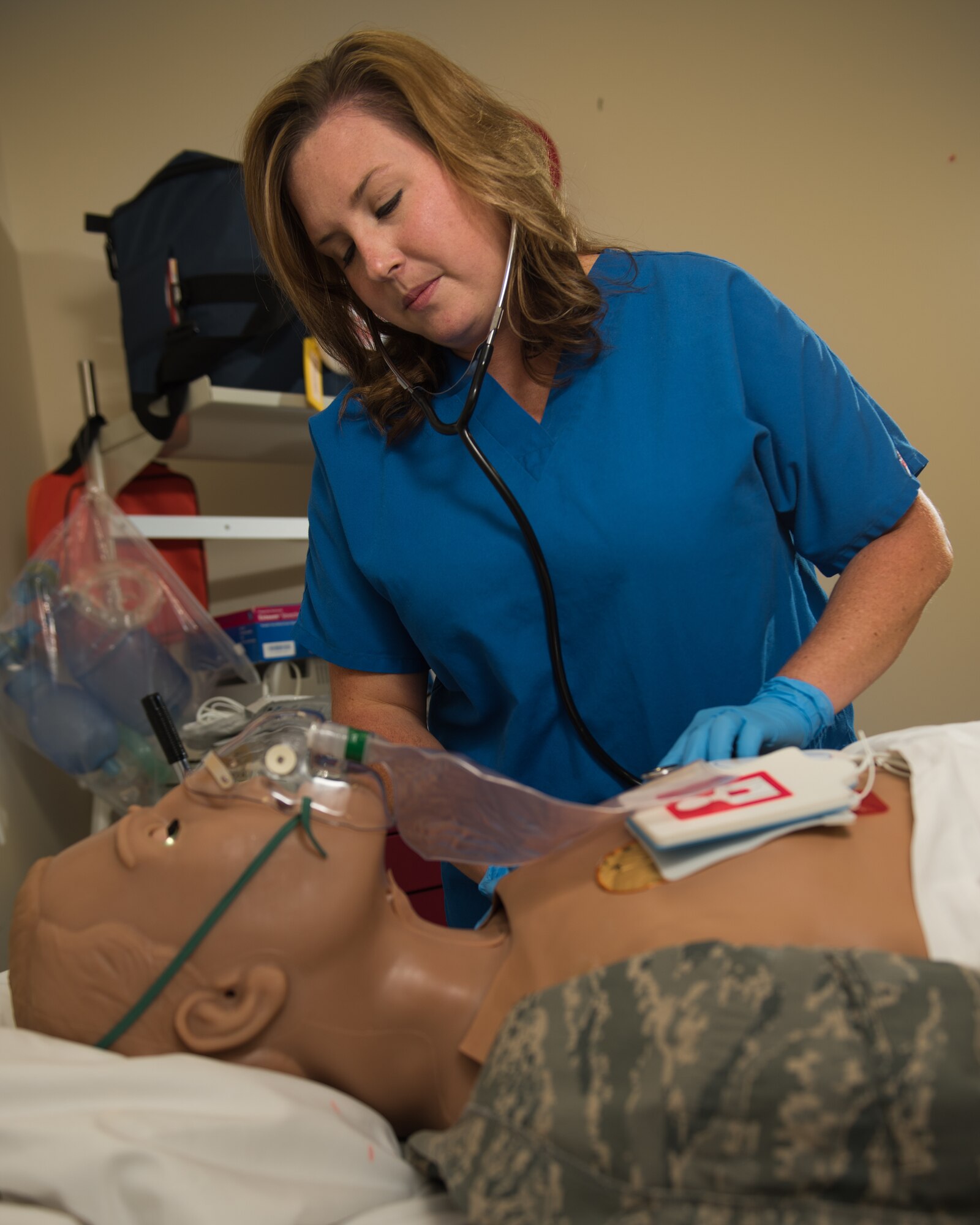 Lauren Nicholson, a 509th Medical Operations Squadron registered nurse, uses a stethoscope to listen to the heartbeat of a training dummy May 6, 2020, at Whiteman Air Force Base, Missouri.