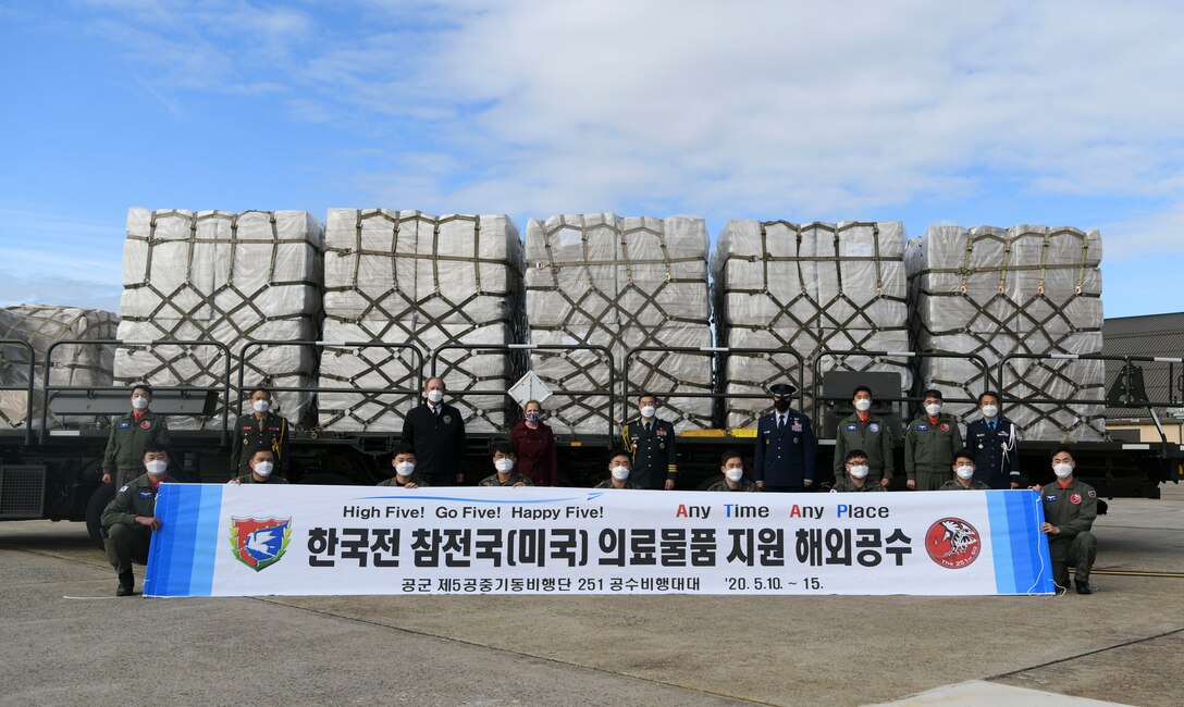 Air Force, Department of Veterans Affairs and South Korean leadership pose for a photo at Joint Base Andrews, Md., May 12, 2020. Officials from the Embassy of the Republic of Korea greeted the arriving Korean military aircrew when the C-130 aircraft landed on JBA. (U.S. Air Force photo by Airman 1st Class Spencer Slocum)
