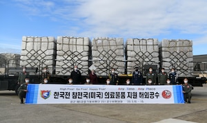 Air Force, Department of Veterans Affairs and South Korean leadership pose for a photo at Joint Base Andrews, Md., May 12, 2020. Officials from the Embassy of the Republic of Korea greeted the arriving Korean military aircrew when the C-130 aircraft landed on JBA. (U.S. Air Force photo by Airman 1st Class Spencer Slocum)