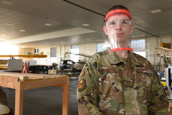 Staff Sgt. Shane Wofford, 373rd Training Squadron, Detachment 8 instructor, poses for a photo March 31, 2020, at McConnell Air Force Base, Kansas. Since the start of building the shields, Wofford and his team have been working around the clock to ensure the printers are working non-stop. After the frames are built, they are sanitized and distributed to those on the frontline battling the coronavirus.(U.S. Air Force photo by Senior Airman Alexi Bosarge)