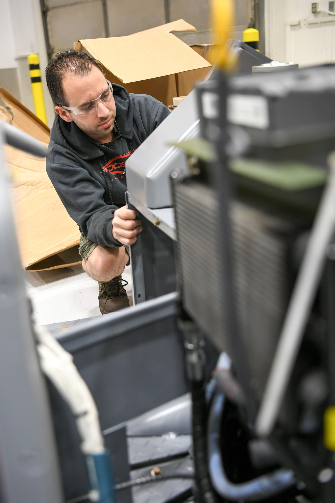 Kevin Watkins, 309th Electronics Maintenance Group, replaces a panel on a MJ-1 jammer April 29, 2020, at Hill Air Force Base, Utah. The 309th EMXG in the Ogden Air Logistics Complex provides repair and overhaul for exchangeable assets for a multitude of systems on a wide assortment of Air Force weapons systems including fighter aircraft, intercontinental ballistic missiles, powered aerospace ground equipment, tactical shelters, as well as refurbishment of radomes worldwide. (U.S. Air Force photo by Cynthia Griggs)