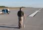 A researcher works on inspecting an airfield.