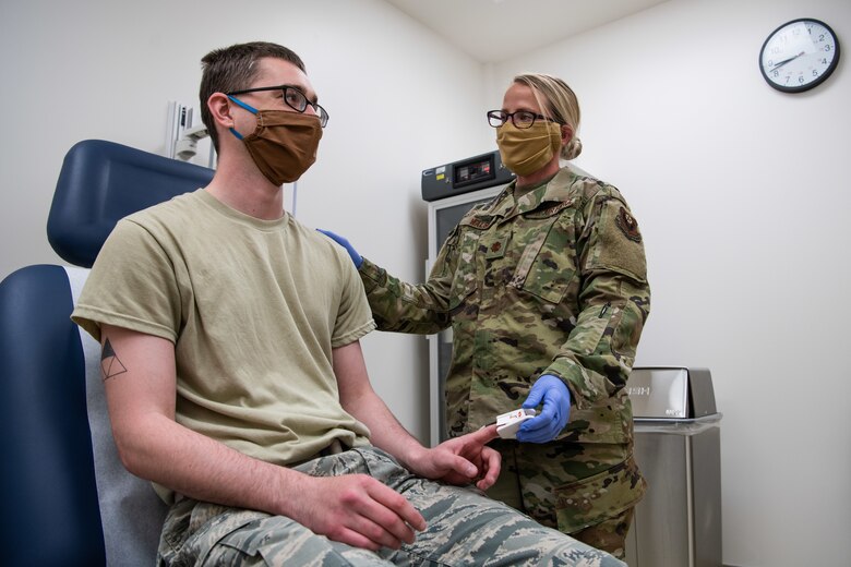 Maj. Jesse Walsh, a clinical nurse assigned to the 27th Special Operations Medical Group, chats with Airman 1st Class Brandon O’Bryant, a medical technician assigned to the 27 SOMDG, during training at Cannon AFB, N.M., May 6, 2020. The theme for International Nurse’s Day 2020 is ‘Nursing the World to Health.’ (U.S. Air Force photo by Senior Airman Maxwell Daigle)