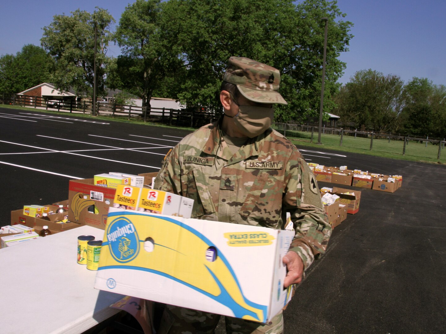 Kentucky National Guard Soldiers from the 138th Field Artillery Brigade Headquarters and Headquarters Battery support the God's Pantry Food Bank in Danville while they supply the local community with food during the COVID-19 pandemic.