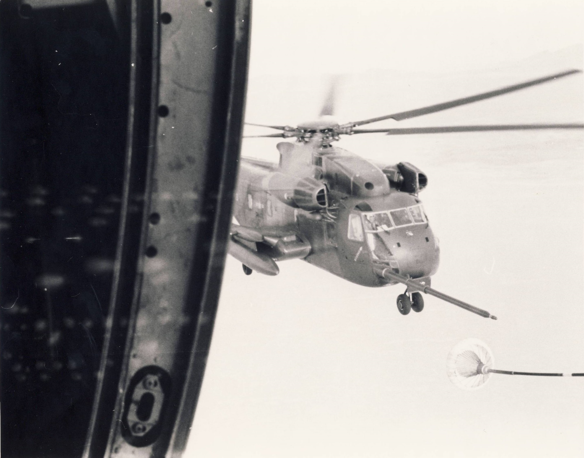 1550th Aircrew Training and Test Wing student pilots, based at Hill AFB in the mid-1970s, trained on HH-53C Super Jolly in-flight re-fueling operations.