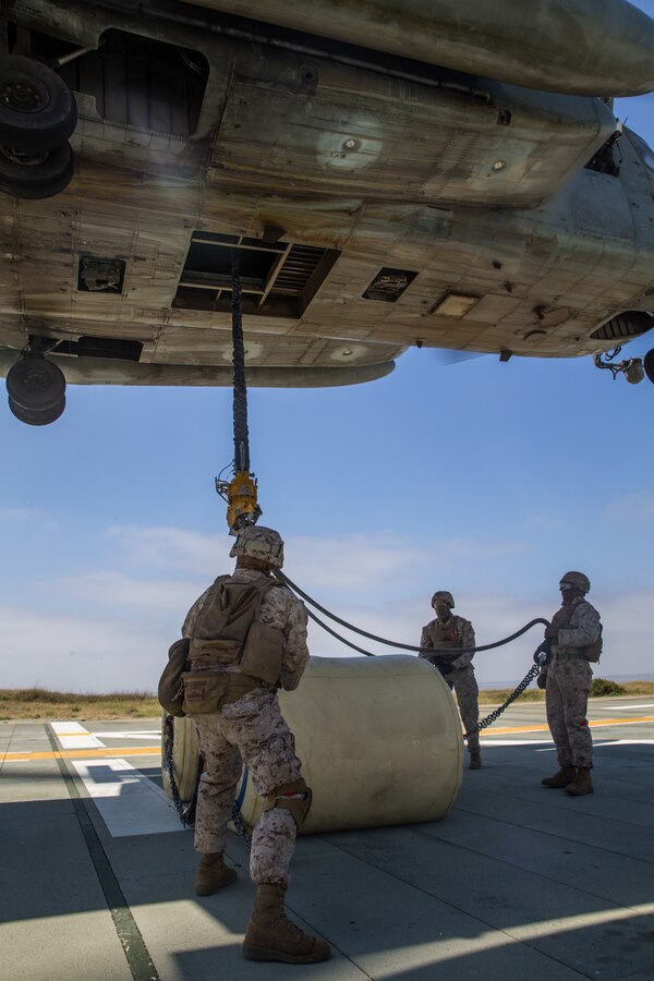 U.S. Marines with Combat Logistics Battalion 15, 15th Marine Expeditionary Unit, maintain control of ropes during helicopter support team training at Marine Corps Base Camp Pendleton, California, May 8, 2020. HSTs enable combined logistics operations and are able to conduct contingency operations, such as tactical recovery of aircraft and personnel missions. (U.S. Marine Corps photo by Lance Cpl. Brendan Mullin)