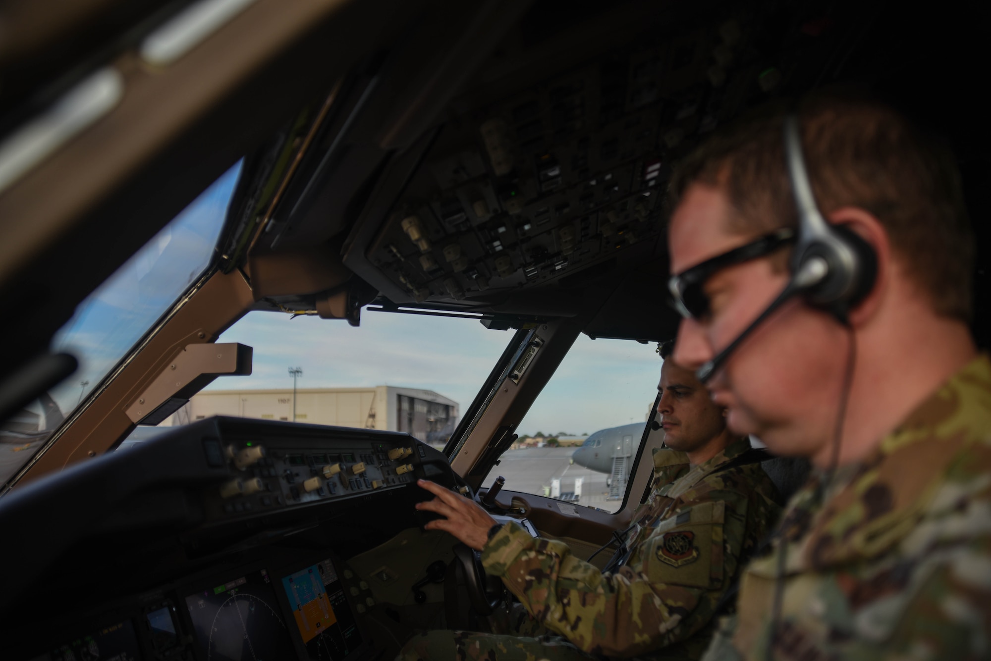 Maj. Thomas Gorry, 344th Air Refueling Squadron chief of group training, performs preflight checks in the KC-46A Pegasus with Col. Mark Baran, 22nd Air Refueling Wing vice commander, April 30, 2020, at McConnell Air Force Base, Kansas. The flight was the last of two training missions to certify aircrews using night vision goggles on the new platform. This allowed aircrews to begin operational testing and evaluation in low-light emission environments. (U.S. Air Force photo by Airman 1st Class Marc A. Garcia)