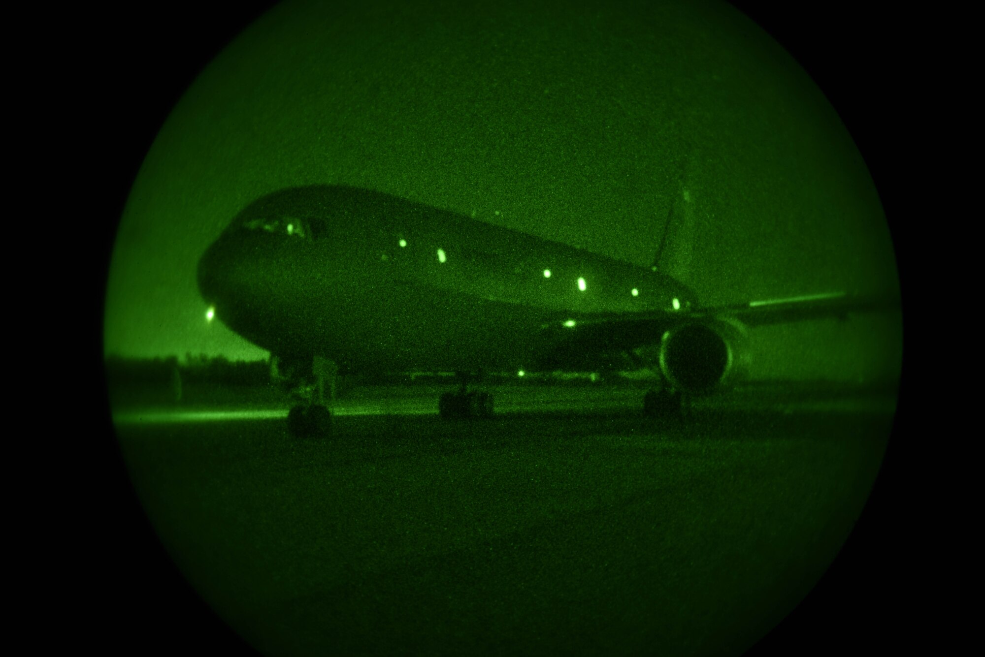 A KC-46A Pegasus parks after performing multiple flight maneuvers April 30, 2020, at North Auxiliary Airfield, South Carolina. The airfield is designed to test airframes and train aircrew in low-light environments. The testing data will be used to advance research in aerial refueling and night flying operations using night vision goggles. (U.S. Air Force photo by Airman 1st Class Marc A. Garcia)