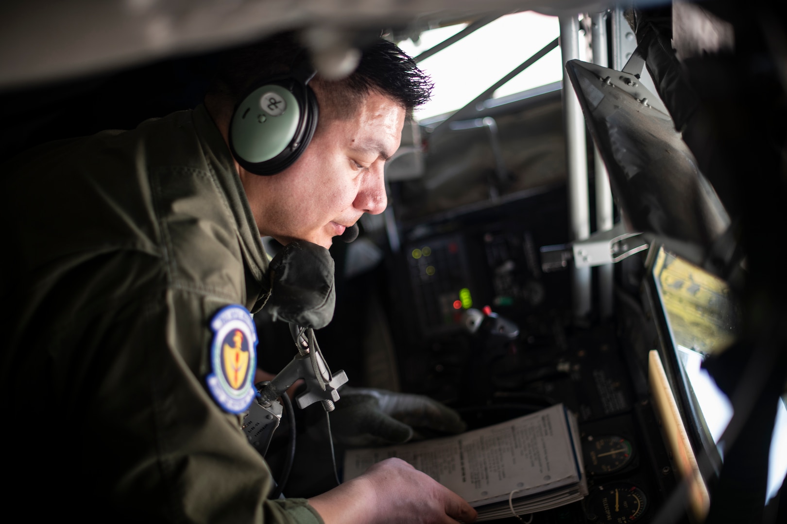 Senior Airman David Rodriquez, 351st Air Refueling Squadron boom operator, reviews a checklist prior to a flight supporting a strategic bomber mission at RAF Mildenhall, England, May 7, 2020. Strategic bomber missions familiarize aircrew with air bases and operations in different Geographic Combatant Command’s areas of operations.