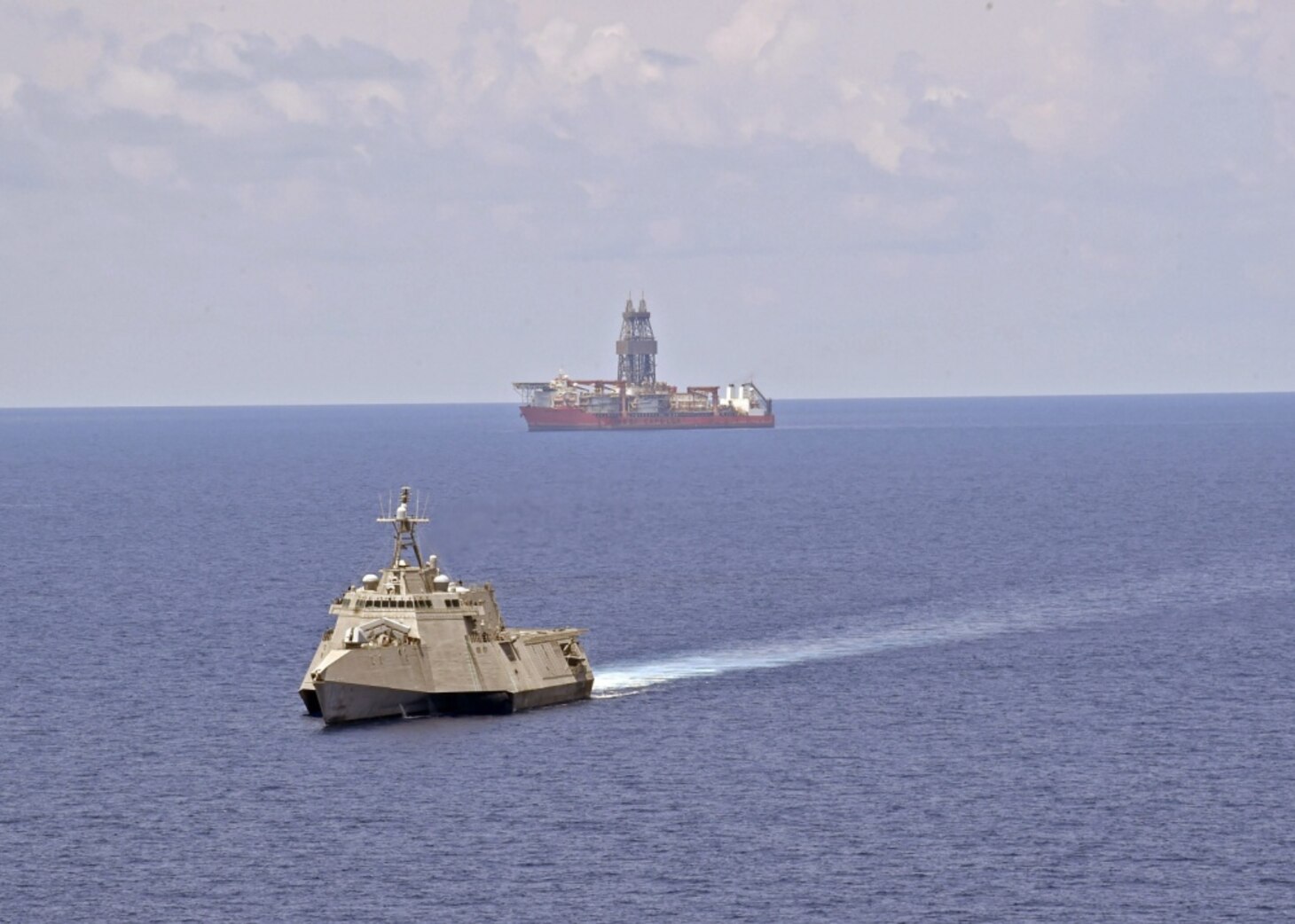 SOUTH CHINA SEA (May 12, 2020) The Independence-variant littoral combat ship USS Gabrielle Giffords (LCS 10) conducts routine operations near the Panamanian flagged drill ship, West Capella, May 12, 2020. Gabrielle Giffords, part of Destroyer Squadron Seven, is on a rotational deployment, operating in the U.S. 7th Fleet area of operations to enhance interoperability with partners and serve as a ready-response force.