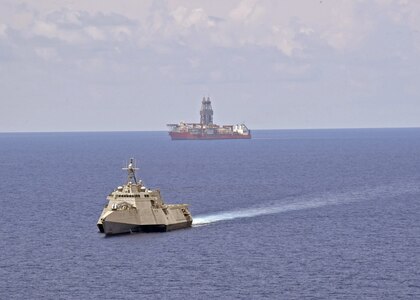 SOUTH CHINA SEA (May 12, 2020) The Independence-variant littoral combat ship USS Gabrielle Giffords (LCS 10) conducts routine operations near the Panamanian flagged drill ship, West Capella, May 12, 2020. Gabrielle Giffords, part of Destroyer Squadron Seven, is on a rotational deployment, operating in the U.S. 7th Fleet area of operations to enhance interoperability with partners and serve as a ready-response force.