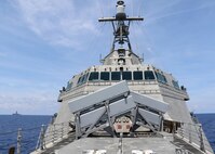 SOUTH CHINA SEA (May 12, 2020) The Independence-variant littoral combat ship USS Gabrielle Giffords (LCS 10) conducts routine operations near the Panamanian flagged drill ship, West Capella, May 12, 2020. Gabrielle Giffords, part of Destroyer Squadron Seven, is on a rotational deployment, operating in the U.S. 7th Fleet area of operations to enhance interoperability with partners and serve as a ready-response force.