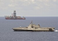 SOUTH CHINA SEA (May 12, 2020) The Independence-variant littoral combat ship USS Gabrielle Giffords (LCS 10) conducts routine operations near the Panamanian flagged drill ship, West Capella, May 12, 2020. Gabrielle Giffords, part of Destroyer Squadron Seven, is on a rotational deployment, operating in the U.S. 7th Fleet area of operations to enhance interoperability with partners and serve as a ready-response force.