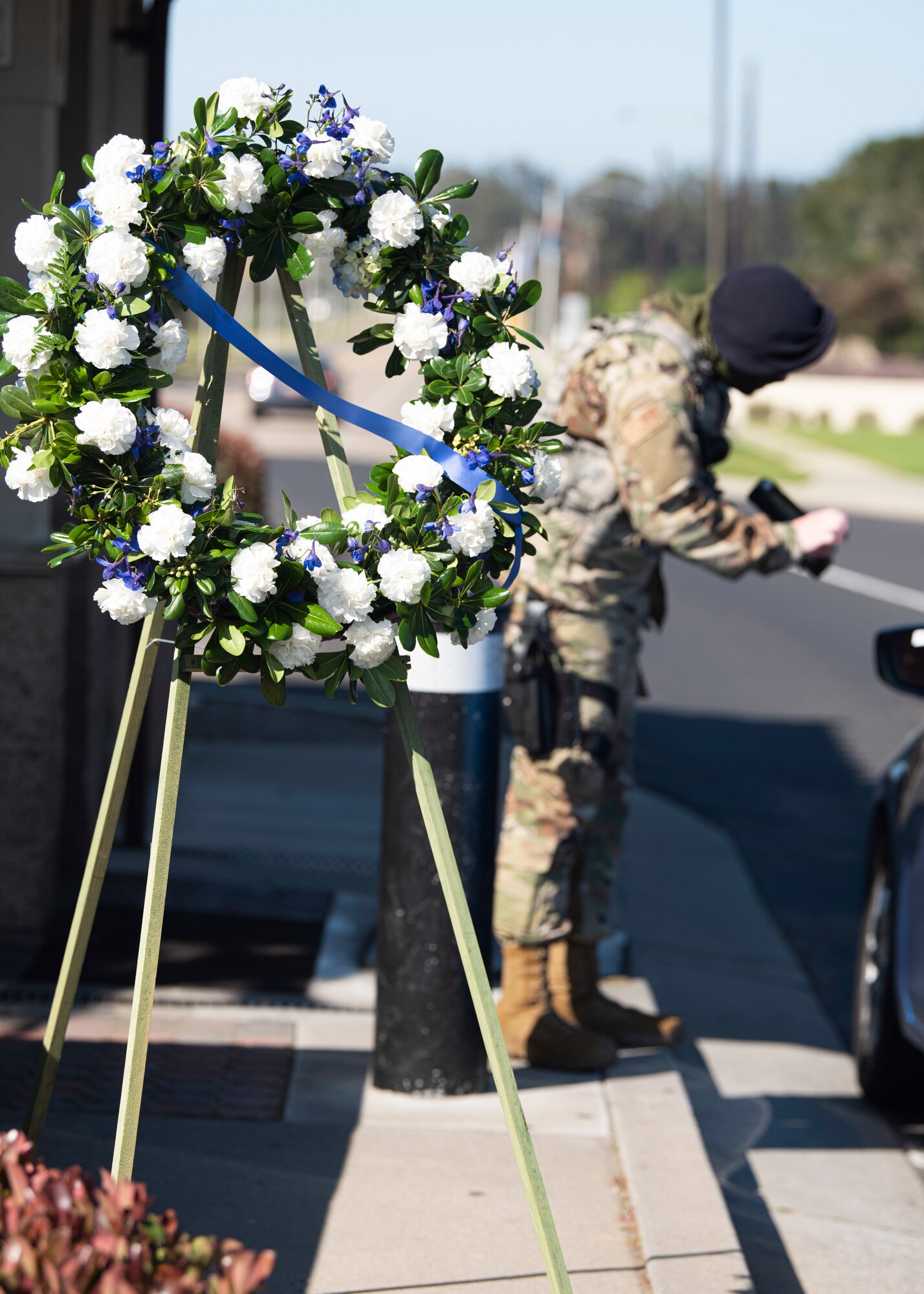 A wreath sits at the main gate in honor of Police Week May 11, 2020, at Vandenberg Air Force Base, Calif. In celebration of National Police Week, which is celebrated in recognition of law enforcement officers who have lost their lives in the line of duty, a wreath was placed at the front gate and the Base Exchange. A memorial with a book of fallen defenders was also displayed in the Exchange to honor their stories and history. (U.S. Air Force photo by Senior Airman Hanah Abercrombie)