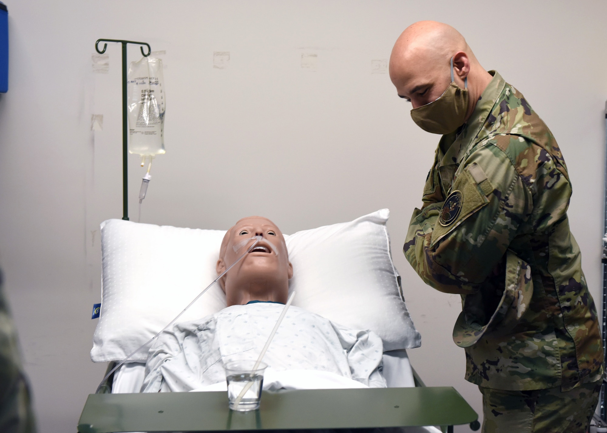 Chief Master Sgt. Robert Devall, 460th Space Wing command chief, looks at a mannequin at the Human Performance Center on Buckley Air Force Base, Colo., May 6, 2020. The 460th Medical Group personnel participated in simulation training scenarios to brush up on their inpatient skills. Chief Devall attended the training to see how the training works first-hand. (U.S. Air Force photo by Airman 1st Class Haley N. Blevins)