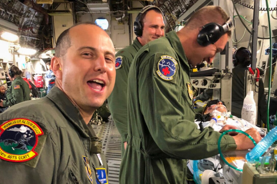 Tech. Sgt. Matt Newman, 514th Aeromedical Staging Squadron, Critical Care Air Transport team respiratory therapist, at the 514th Air Mobility Wing, Joint Base McGuire-Dix-Lakehurst, N.J. and Tech. Sgt. Dave Rudd, also a respiratory therapist, with the 433rd Medical Group at Joint Base San Antonio, Texas, pose for a photo during a training exercise in 2018.