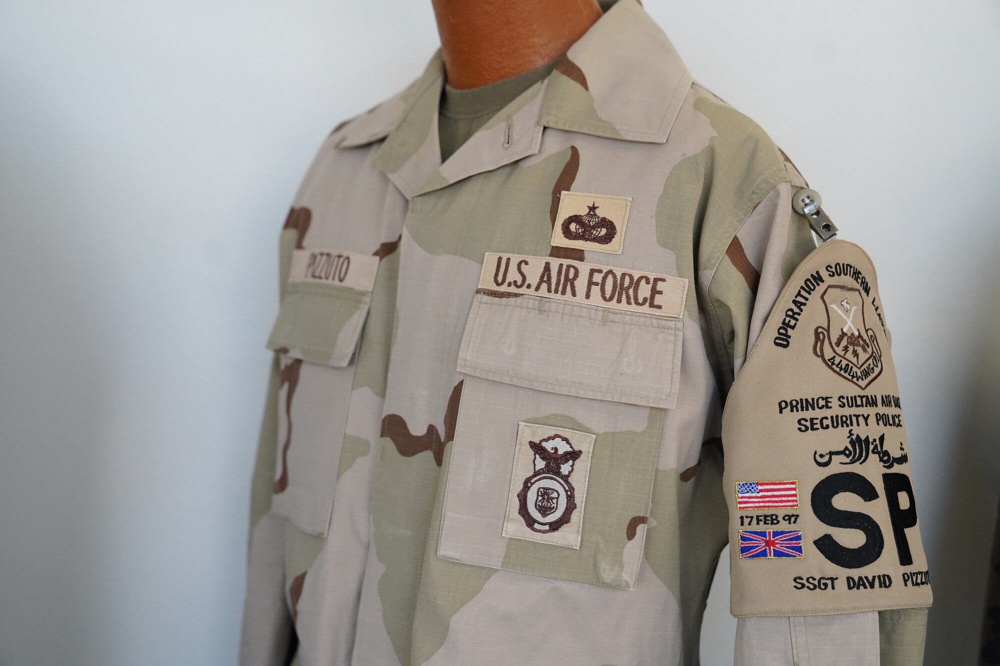 A Desert Camouflage Uniform owned by Chief Master Sgt. David Pizzuto, 81st Training Wing command chief, is displayed inside of the Levitow Training Support Facility at Keesler Air Force Base, Mississippi, May 6, 2020. Pizzuto, who is slated to retire this month, has served for 37 years and has worn every uniform the Air Force has ever known. (U.S. Air Force photo by Airman 1st Class Spencer Tobler)