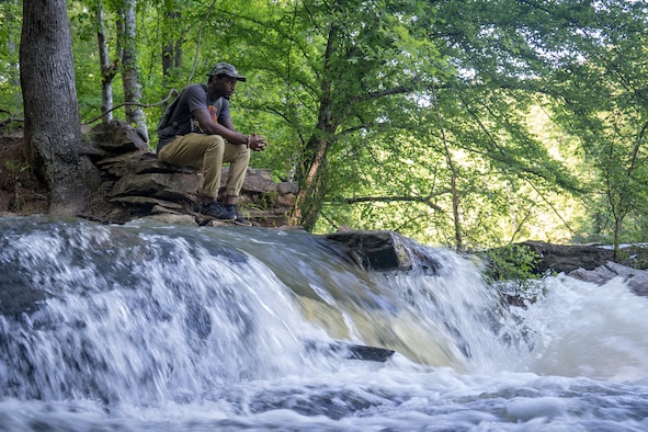 Shelton Sherrill watches the water flow across the rocks. (Courtesy photo by Shelton Sherrill)