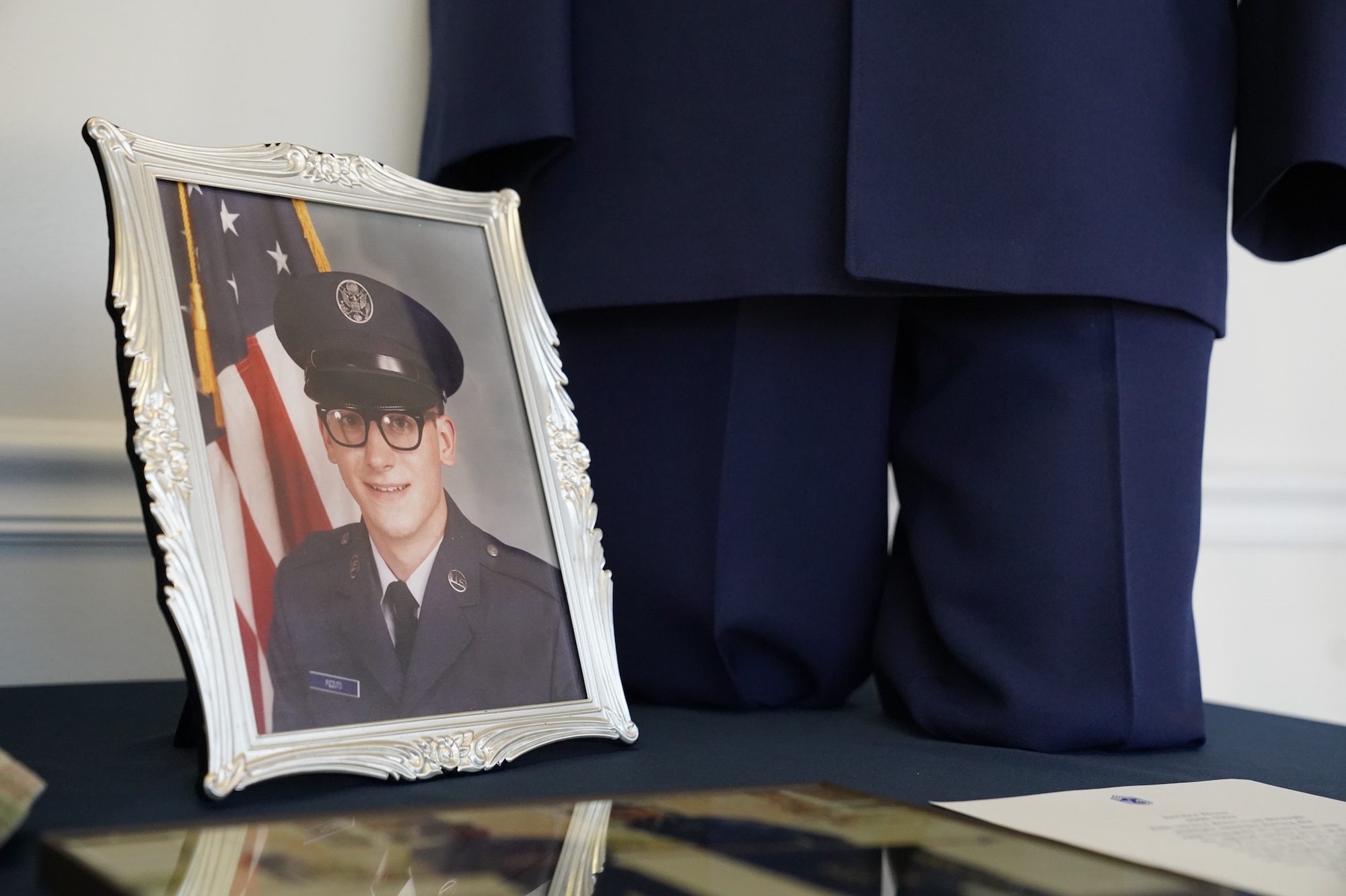 A picture of Chief Master Sgt. David Pizzuto, 81st Training Wing command chief, is displayed inside of the Levitow Training Support Facility at Keesler Air Force Base, Mississippi, May 6, 2020. Pizzuto, who is slated to retire this month, has served for 37 years and has worn every uniform the Air Force has ever known. (U.S. Air Force photo by Airman 1st Class Spencer Tobler)