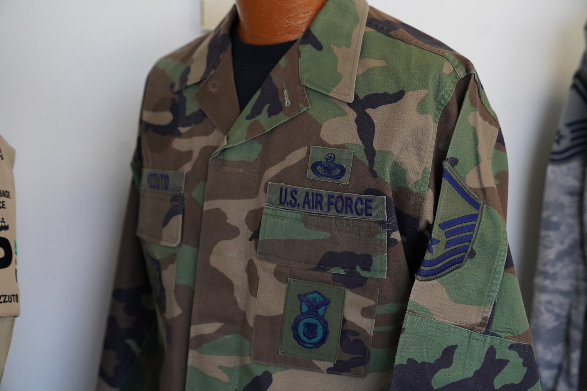A battle dress uniform owned by Chief Master Sgt. David Pizzuto, 81st Training Wing command chief, is displayed inside of the Levitow Training Support Facility at Keesler Air Force Base, Mississippi, May 6, 2020. Pizzuto, who is slated to retire this month, has served for 37 years and has worn every uniform the Air Force has ever known. (U.S. Air Force photo by Airman 1st Class Spencer Tobler)
