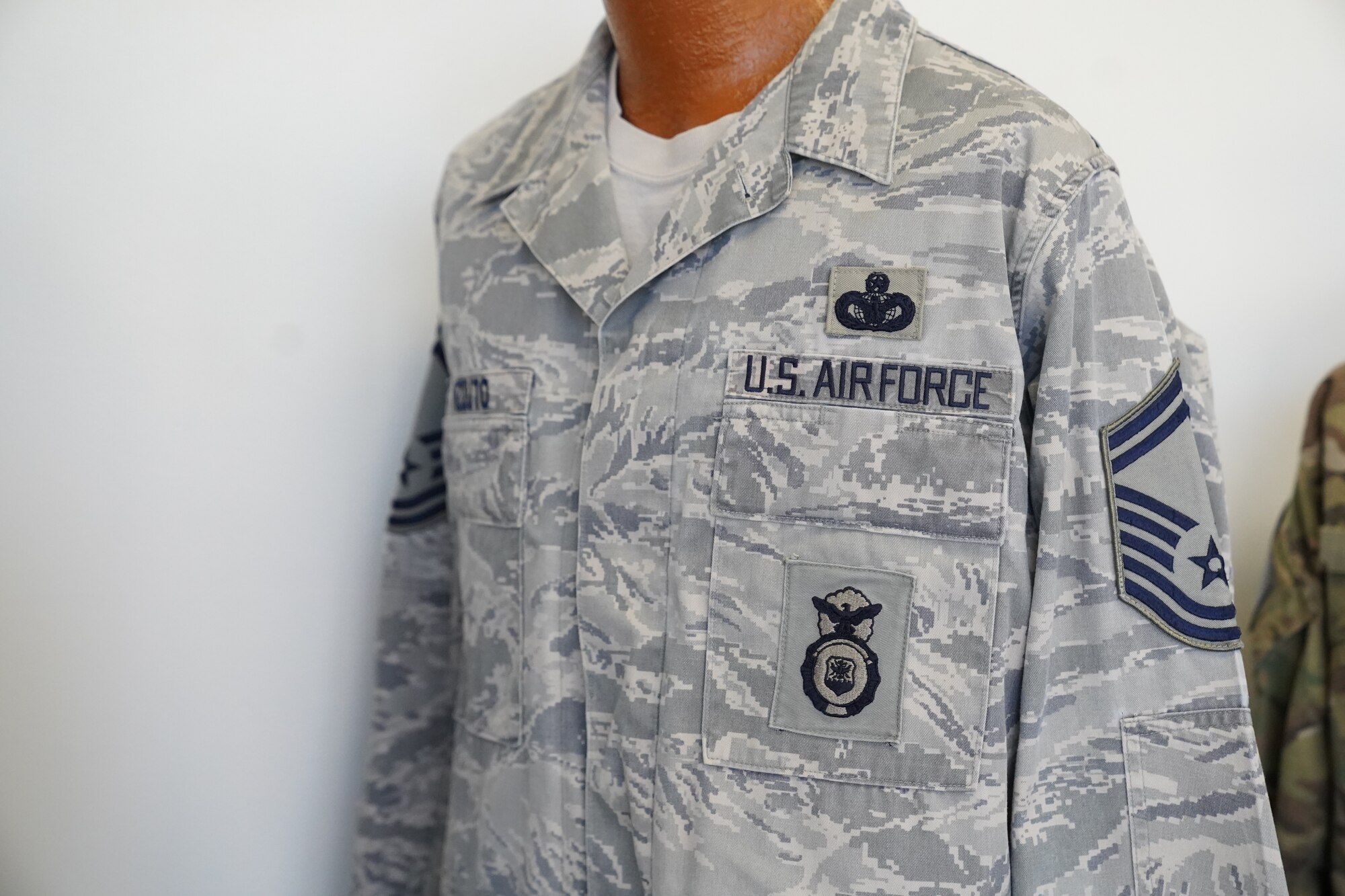 An Airman Battle Uniform owned by Chief Master Sgt. David Pizzuto, 81st Training Wing command chief, is displayed inside of the Levitow Training Support Facility at Keesler Air Force Base, Mississippi, May 6, 2020. Pizzuto, who is slated to retire this month, has served for 37 years and has worn every uniform the Air Force has ever known. (U.S. Air Force photo by Airman 1st Class Spencer Tobler)