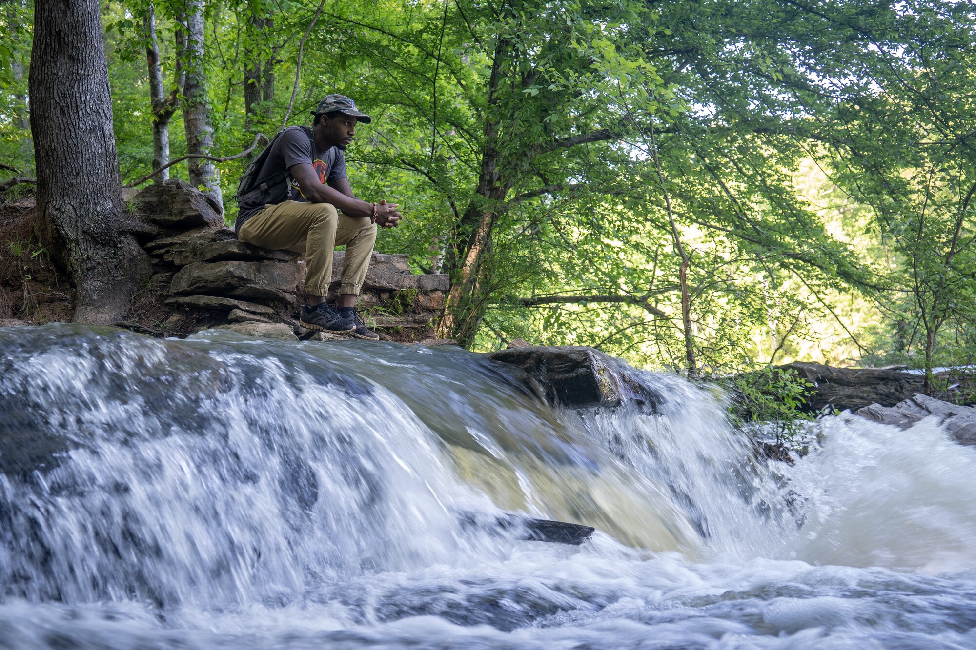 Shelton Sherrill watches the water flow across the rocks. (Courtesy photo by Shelton Sherrill)