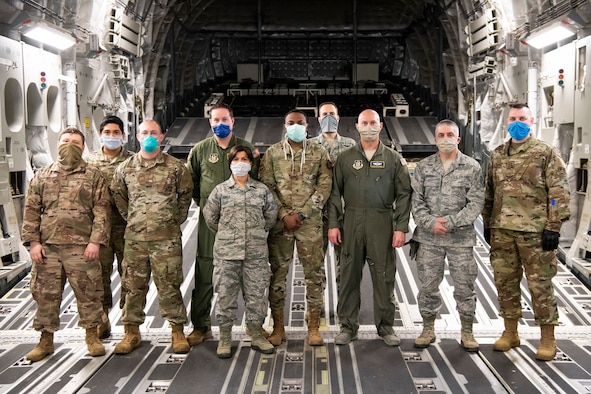 Military members from six units across the U.S., which comprise their Transport Isolation System mission team, pose for a group photo in a C-17 Globemaster III at Dover Air Force Base, Delaware, May 5, 2020. The personnel are assigned to two Transportation Isolation Systems that will remain at Dover AFB as long as required as part of the government’s response to COVID-19. (U.S. Air Force photo by Senior Airman Christopher Quail)