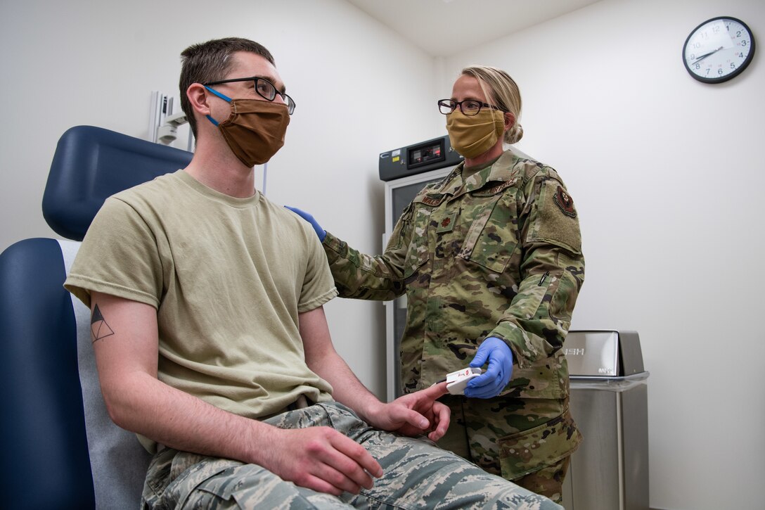 U.S. Air Force Maj. Jesse Walsh, a clinical nurse assigned to the 27th Special Operations Medical Group, chats with Airman 1st Class Brandon O’Bryant, a medical technician assigned to the 27 SOMDG, during training at Cannon Air Force Base, New Mexico, May 6, 2020. (U.S. Air Force photo by Senior Airman Maxwell Daigle)